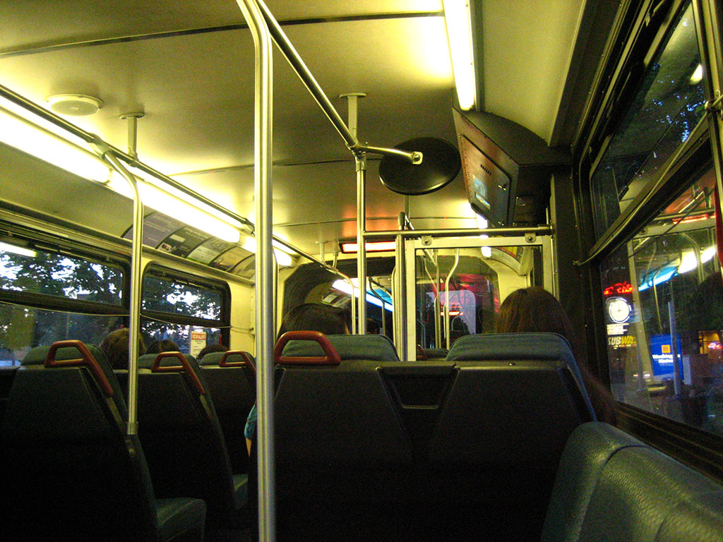 Sitting in the bus, looking down the aisle from the back